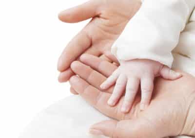 hand,of,a,child,in,mother's,hands,isolated,on,a