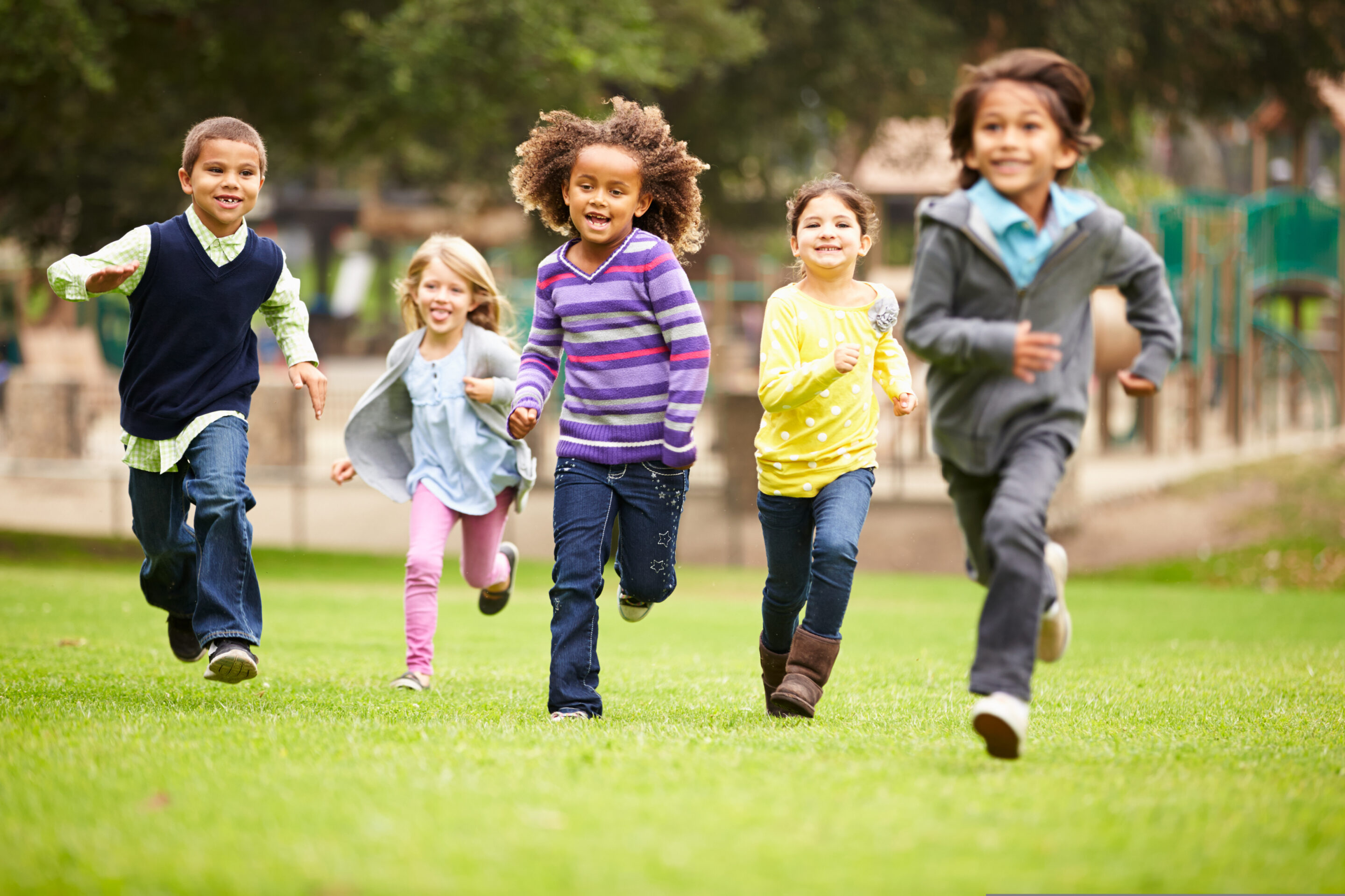 group,of,young,children,running,towards,camera,in,park
