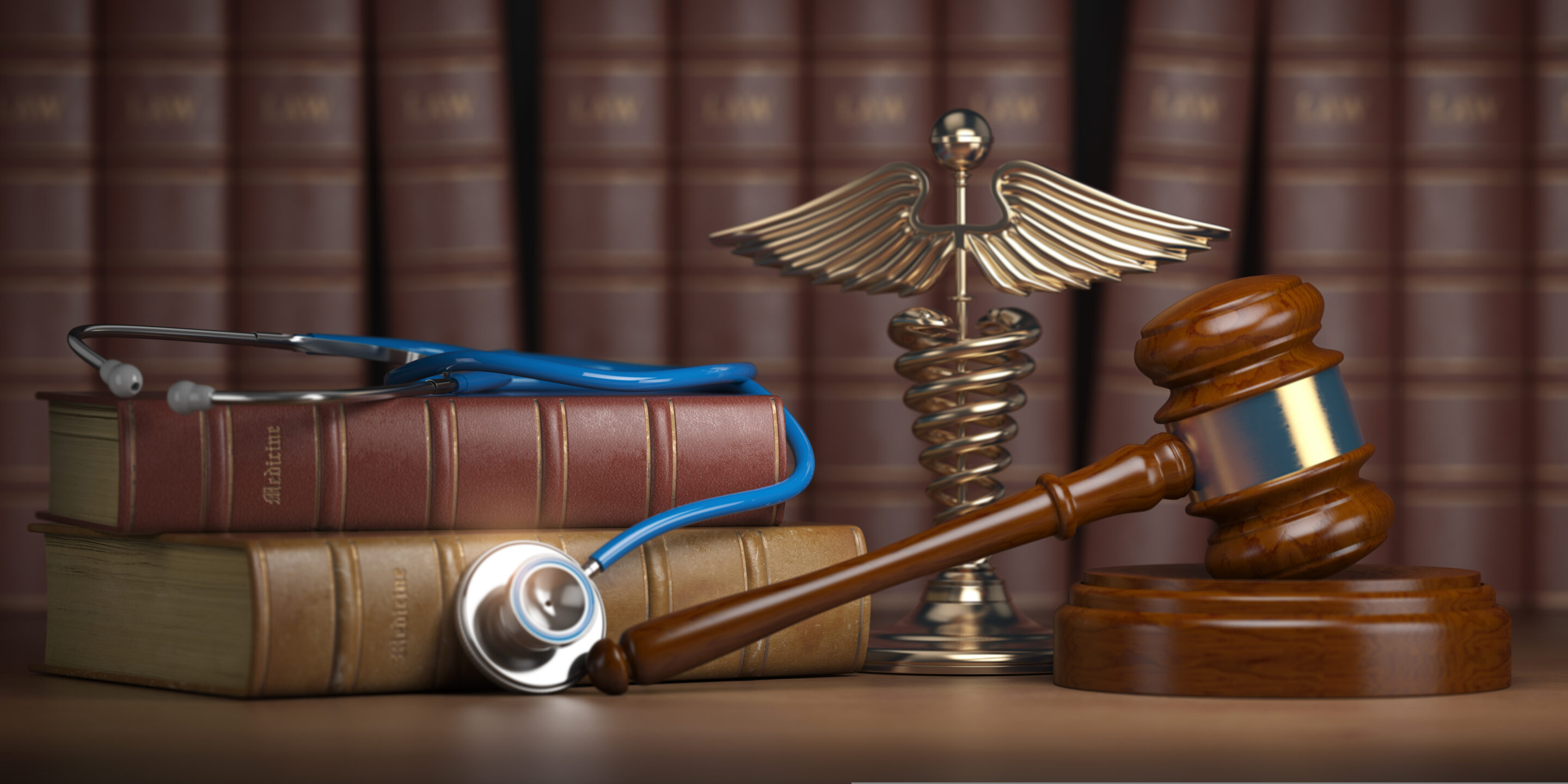 gavel,,stethoscope,and,caduceus,sign,on,books,background.,mediicine,laws
