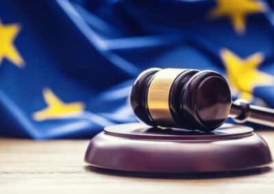 judges wooden gavel with eu flag in the background. symbol for jurisdiction