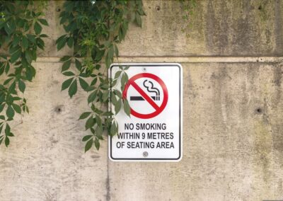 no,smoking,sign, ,affixed,to,a,concrete,wall, 