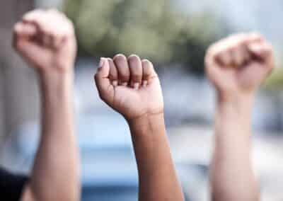 outdoor,,hands,and,fist,in,protest,for,freedom,,human,rights