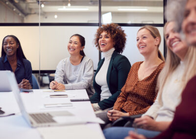 line,of,businesswomen,in,modern,office,listening,to,presentation,by