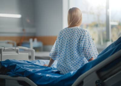 hospital,ward:,beautiful,caucasian,female,patient,sitting,on,a,bed,