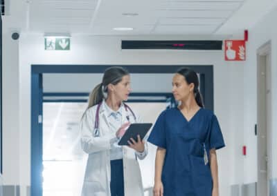 bright,hospital,hallway,with,diverse,medical,team,headed,to,their